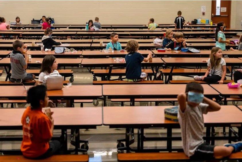 Students are socially distanced in the lunchroom at Jacob’s Well Elementary School in Wimberley. The Texas Health and Human Services Commission will allocate around $2.5 billion in food benefits to all eligible families. School districts will notify families about eligibility by June 2.